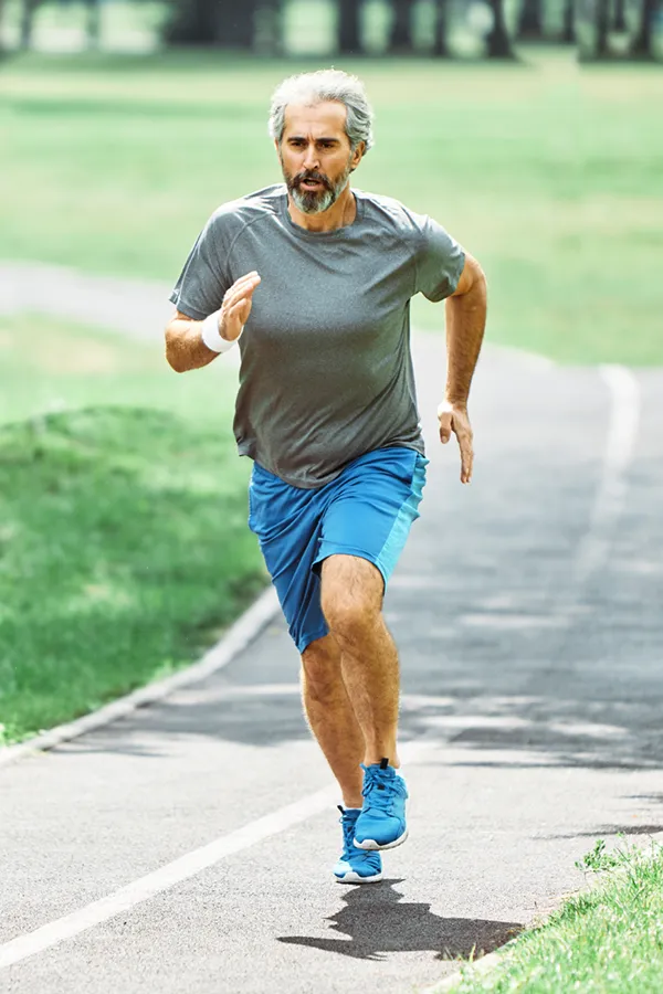 ACL-Tears-Treatment A man running on a track. Get treatment for ACL tears from Dr. Noelani Rodriguez in San Diego.