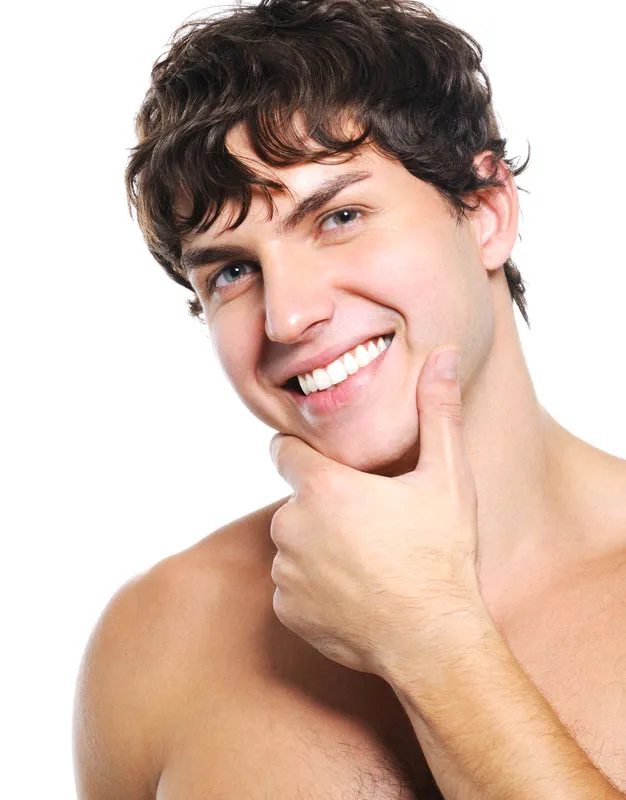 Acne-Treatment Zoomed-in image of clear skin on a smiling man's face, highlighting successful acne treatment by Dr. Noelani Rodriguez in San Diego.