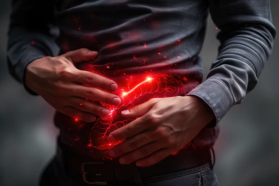 Inflammotory-Bowel-Disease-IBD-Clinic A man clutches his abdomen, with a digital illustration of inflamed intestines glowing in red. Dr. Noelani Rodriguez offers advanced inflammatory bowel disease (IBD) treatment in San Diego using functional medicine and gut-focused therapies.
