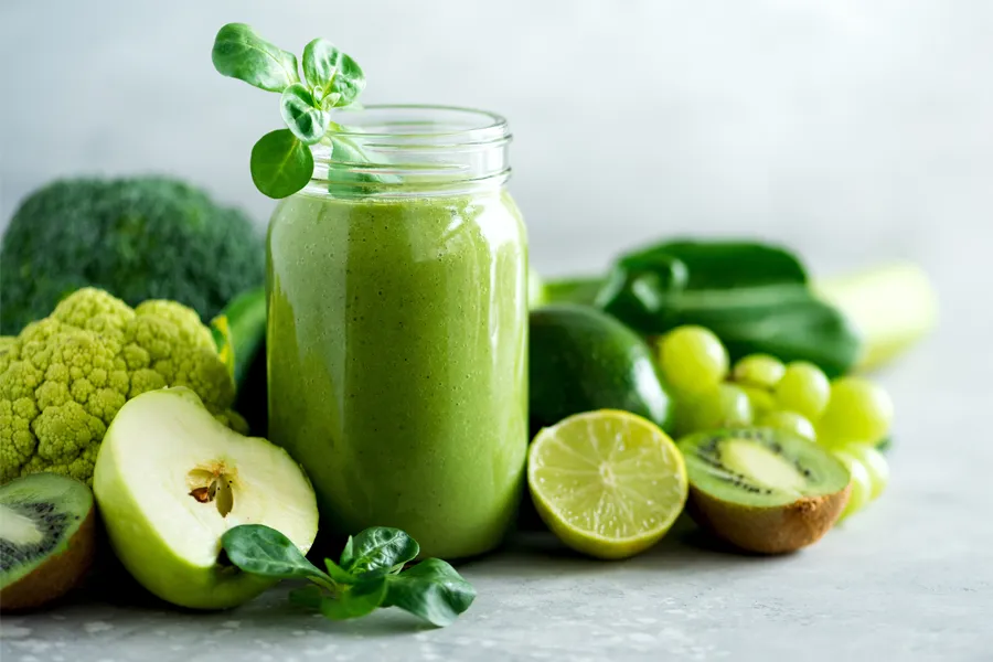 Nutritional-Counseling-Clinic A tableau of healthy green fruits and vegetables and juices. Get nutritional counseling from Dr. Noelani Rodriguez in San Diego.