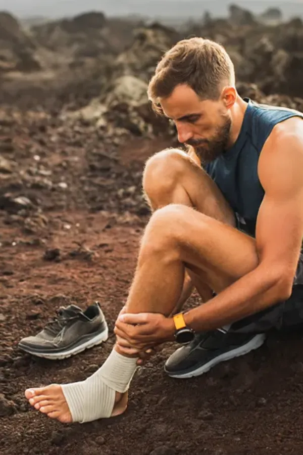 Plantar-Fasciitis-Treatment A man holds his ankle and foot in pain. Get plantar fasciitis treatment from Dr. Noelani Rodriguez in San Diego.