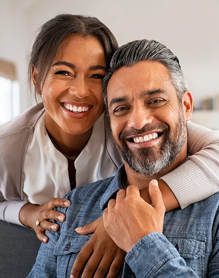 Close up of a smiling couple satisfied with the health and wellness services offered by Maven Wellness in San Diego.