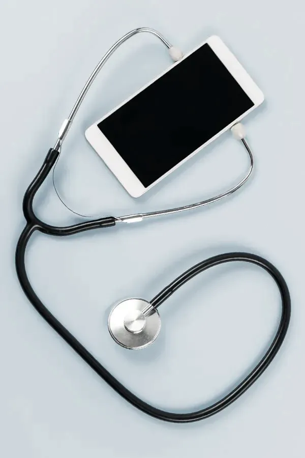 Telemedicine-Treatment A smartphone with a stethoscope attached to it, symbolizing Telemedicine treatment from Dr. Noelani Rodriguez in San Diego.